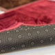 Non-slip dotted backing of the Brown & Maroon Couple Janamaz Set, ensuring safety and comfort during prayer on smooth surfaces.
