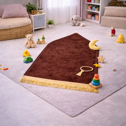 Brown Kids Dome Janamaz - Kids Prayer Rug placed in playroom with toys, soft and foldable design perfect for children aged 3-10.