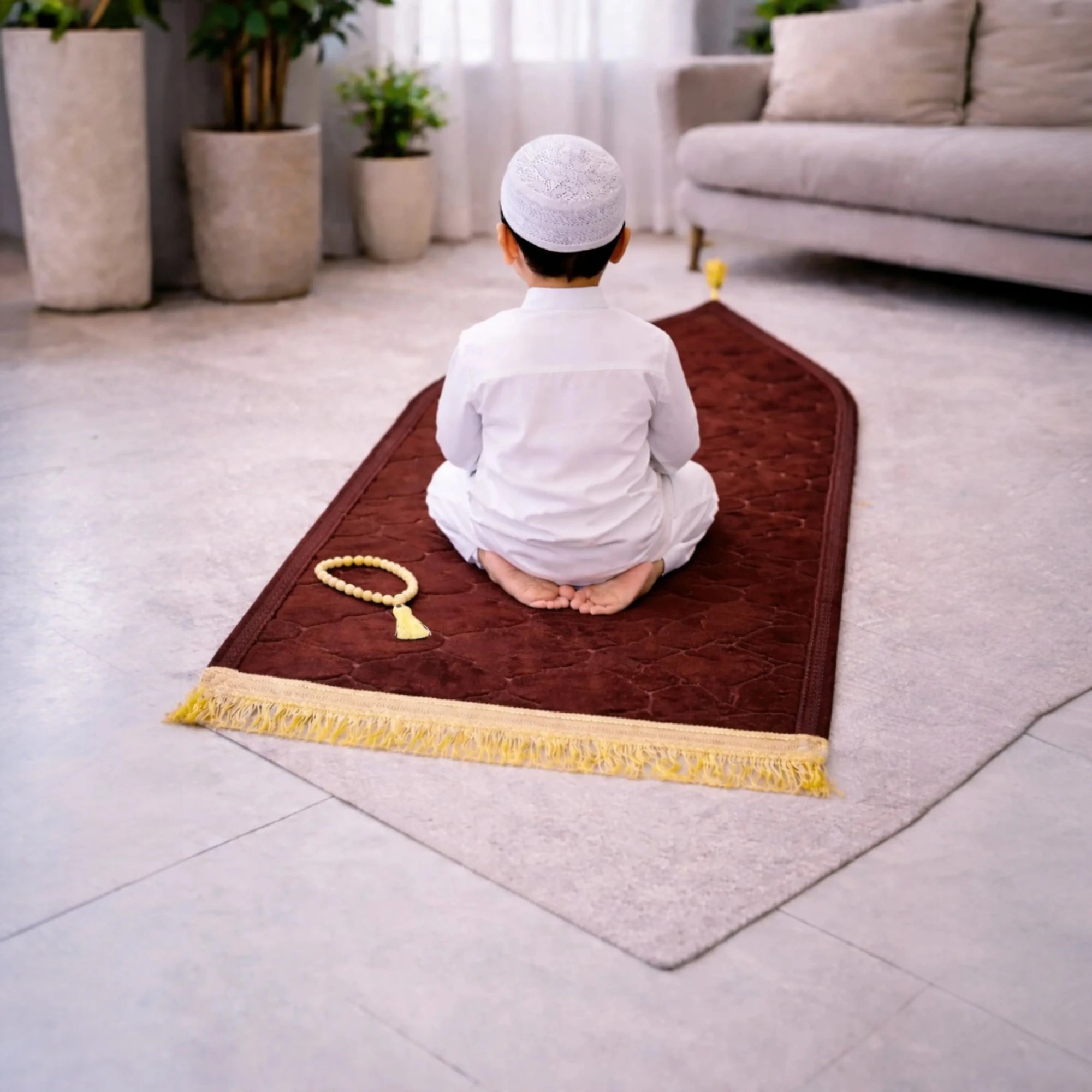 Brown Kids Dome Janamaz - Kids Prayer Rug in use by child in white attire, soft and foldable, ideal for home prayer setting. Main image