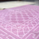 Detailed texture of pink rectangle Janamaz from the Couple Prayer Mats Set, made with soft premium fabric.
