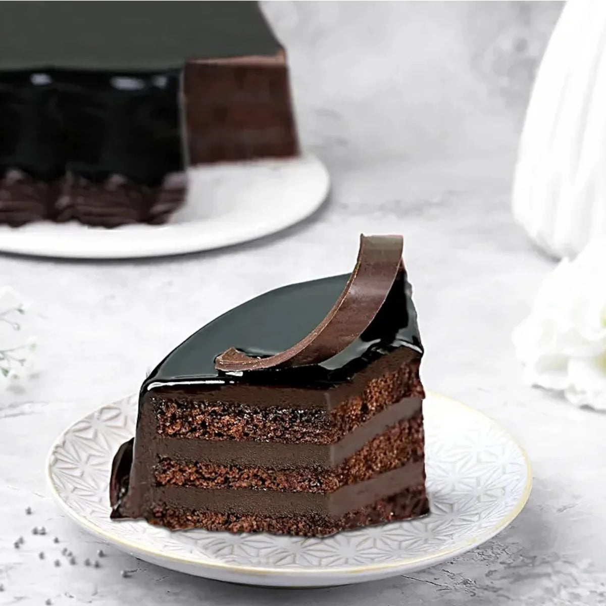 Slice of Chocolate Truffle Cake - Rich Indulgence showing moist chocolate layers and velvety ganache, ideal for dessert lovers.