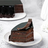 Slice of Chocolate Truffle Cake - Rich Indulgence showing moist chocolate layers and velvety ganache, ideal for dessert lovers.