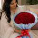 Classic Aura 12 Red Roses Bouquet arranged in packaging, close-up