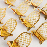 Multiple empty crescent-shaped gold acrylic date stands featuring an intricate lattice design and top crescent moon, arranged in neat rows on a plain white surface.