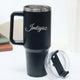 Close-up of black stainless steel tumbler with custom text