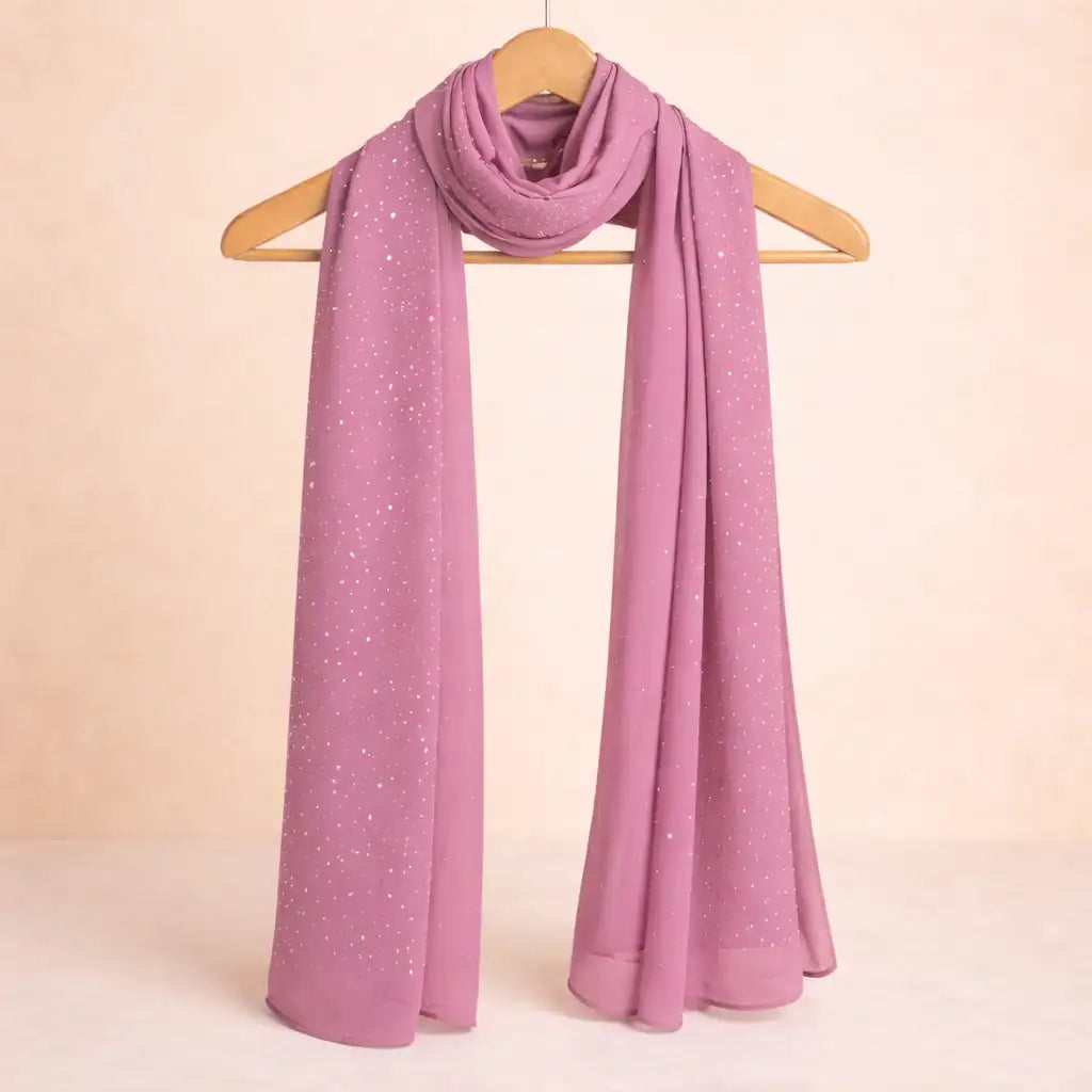 Dark pink studded hijab with smooth chiffon texture, elegantly draped on a wooden hanger. Ideal for versatile modest fashion styling. Main image
