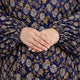 Close-up of Prayer Dress 4's gathered sleeve cuffs and floral pattern, highlighting comfort and detail in modest fashion accessories.