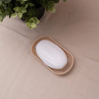 Unscented Soap with Container - Ihram Soap | White unscented soap bar labeled 'IHRAM' placed in beige soap tray for sacred travel use.