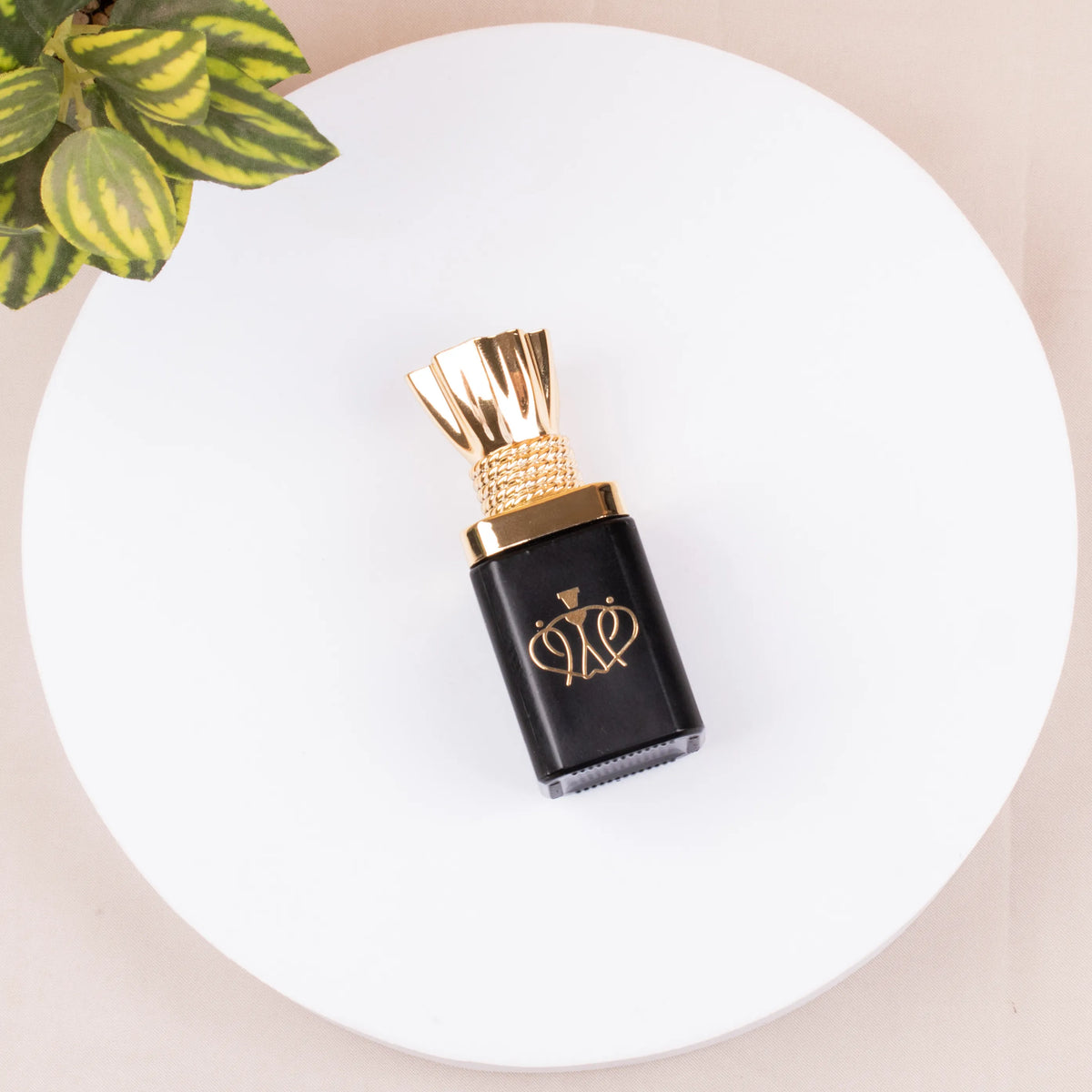 Luxury black and gold attar bottle from the Zad-al-Hajj Men's Kit - Hajj Umrah Essentials, alcohol-free fragrance suitable for Ihram use.
