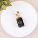 Luxury black and gold attar bottle from the Zad-al-Hajj Men's Kit - Hajj Umrah Essentials, alcohol-free fragrance suitable for Ihram use.