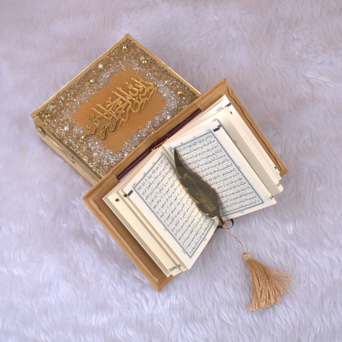 Open Golden Sequence Mini Tilawat-e-Quran - Velvet Mini Quran Set showing Arabic script pages, gold feather bookmark, and glittered designer box.
