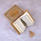 Open Golden Sequence Mini Tilawat-e-Quran - Velvet Mini Quran Set showing Arabic script pages, gold feather bookmark, and glittered designer box.