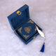 Mini Tilawat-e-Quran placed inside an open blue velvet designer box with gold clasp, from the Velvet Quran Gift Set collection.