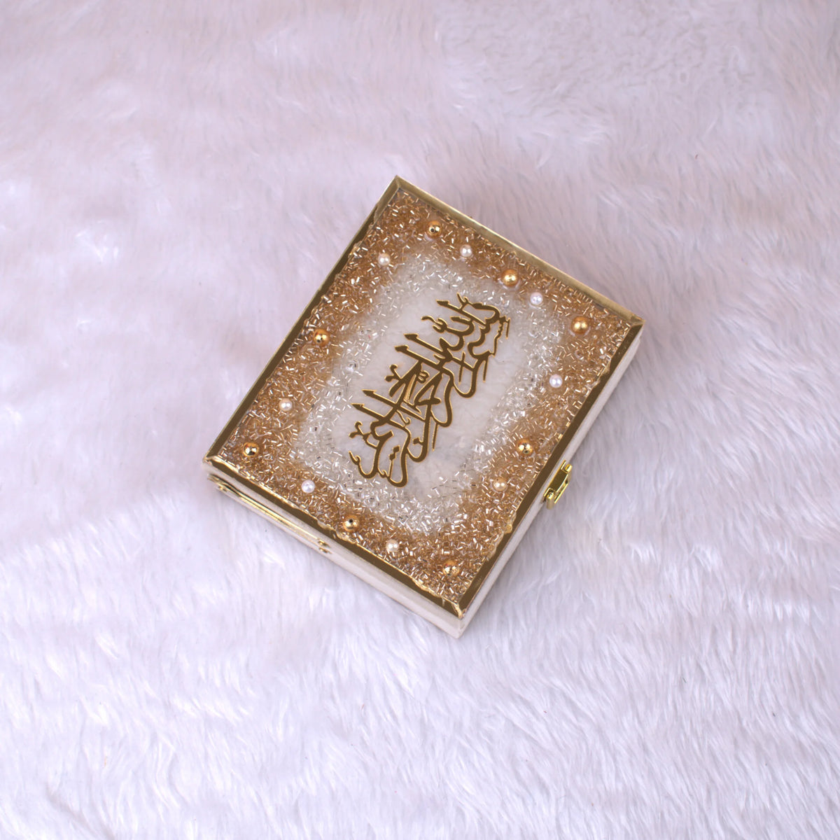 Closed gold-sequined Quran gift box with Arabic calligraphy, part of the Mini Velvet Quran Set for premium religious and ceremonial gifting.