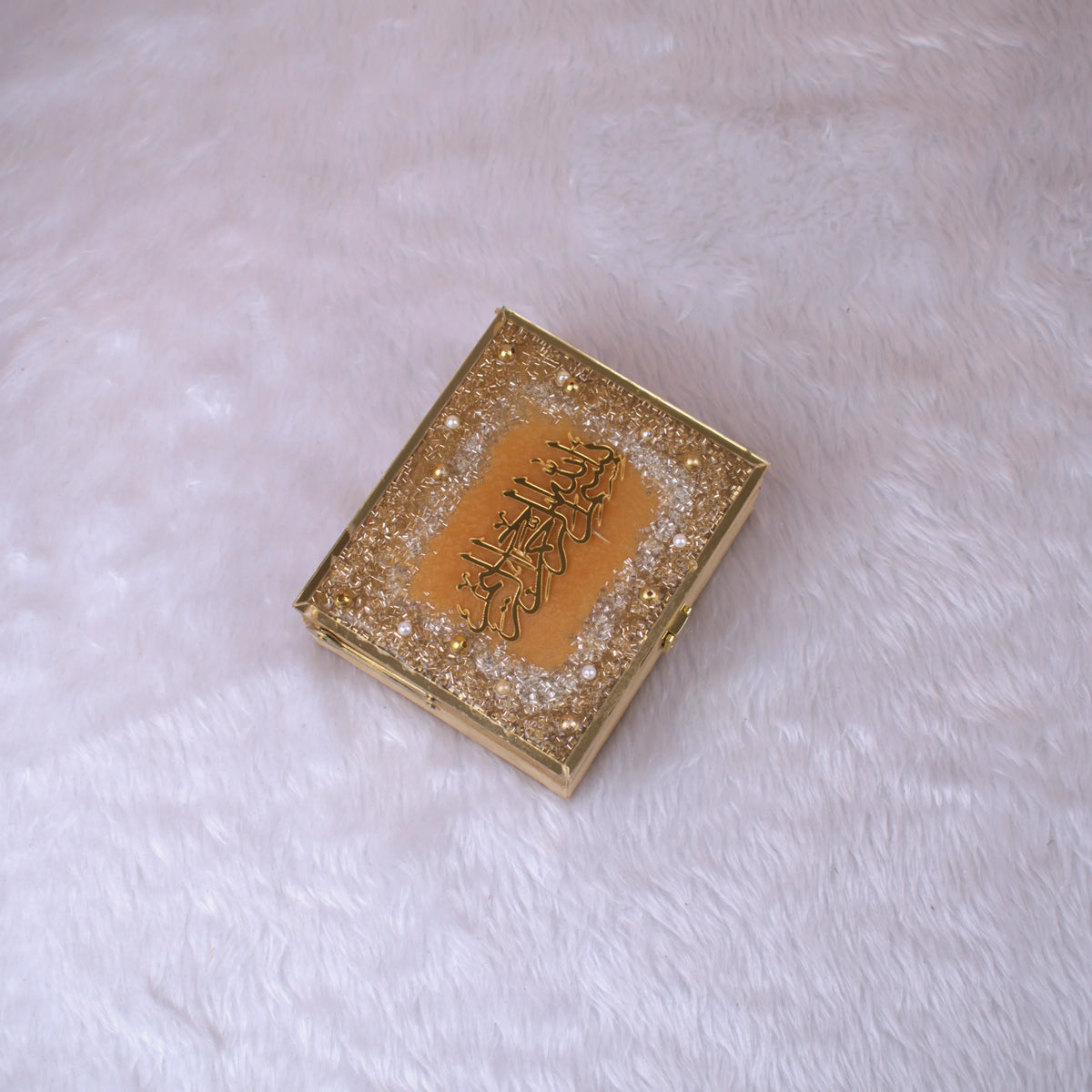 Closed Golden Sequence Mini Tilawat-e-Quran designer box with glitter and Arabic calligraphy, part of the Velvet Mini Quran Set gift collection.