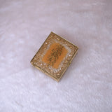 Closed Golden Sequence Mini Tilawat-e-Quran designer box with glitter and Arabic calligraphy, part of the Velvet Mini Quran Set gift collection.