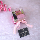 Elegant Pink Hijab Set in a clear-lid box with ribbon, includes hijab, cap, pin, and floral decor—ideal for bridal or Ramadan gifts.