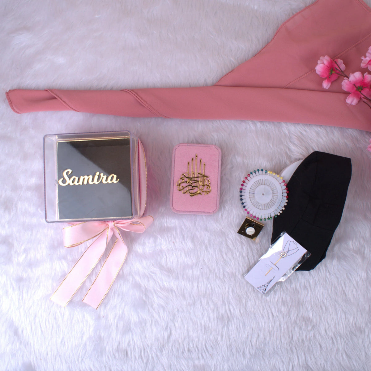 Unboxed Pink Hijab Set with chiffon hijab, black cap, designer pin, and accessories beside personalized gift box—great for women’s fashion.