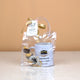 Barakah Blessings Hamper in clear pouch with ribbon, Hajj Mubarak tag, mug, keychain, and chocolates. Elegant Hajj gift for loved ones.