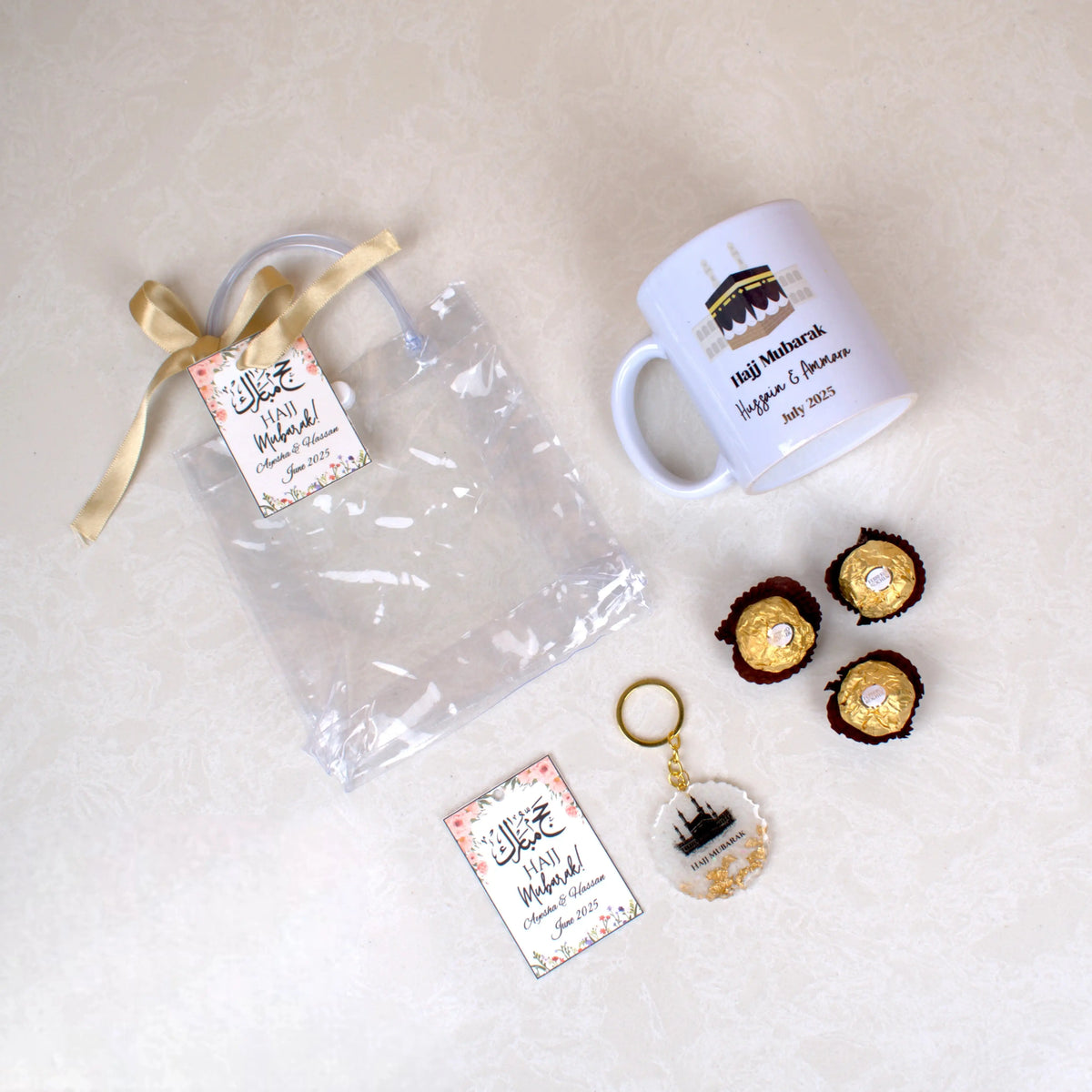 Unboxed Barakah Blessings Hamper featuring Sacred Sips Mug, Tawaf Keychain, Ferrero Rocher chocolates, and clear gift pouch. Perfect Hajj return gift.