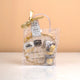 Makkah Moments Hamper packaged in a clear gift bag with ribbon, includes personalized Hajj frame, chocolates, and keychain. Great for gifting.