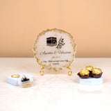 Islamic Gift Hamper featuring custom Hajj frame with Kaaba design, chocolates, and keychain, perfect for Hajj & Umrah return gifts.