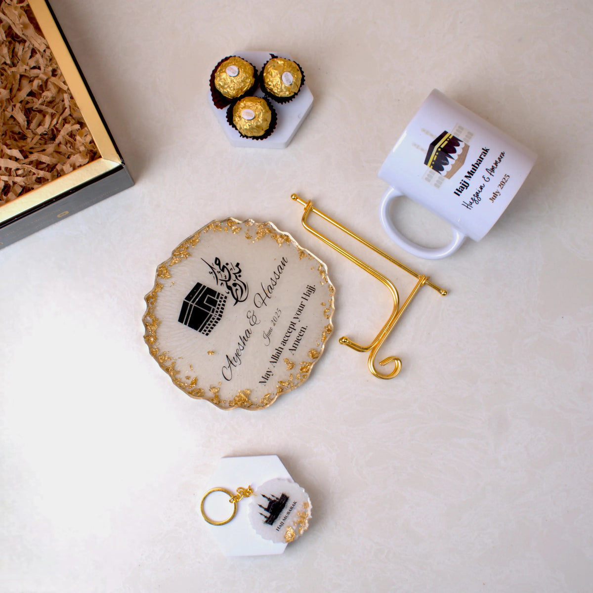 Hearts of Hajj Hamper - Hajj Gift set with Kaaba-themed coaster, personalized mug, keychain, and chocolates, ideal for post-Hajj souvenirs.