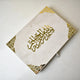 Offwhite Islamic hamper with devotional essentials and gourmet chocolates presented in a sophisticated A3 designer gift box