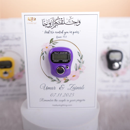 Purple digital Tasbeeh counter on a Nikah Favours card with floral design and wedding date. A modern Islamic wedding favor for prayer tracking.