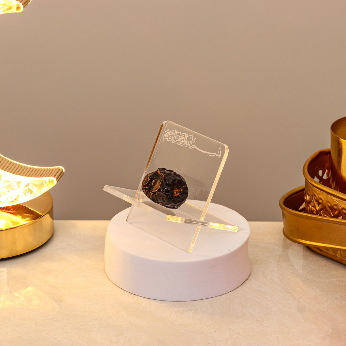 Acrylic Date Stand Ramadan with Bismillah engraving, displayed on a white base, ideal for elegant Iftar table decor or Ramadan gifting.