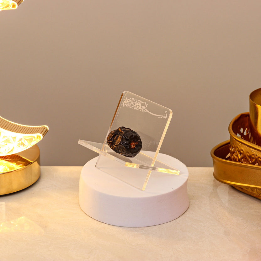 Acrylic Date Stand Ramadan with Bismillah engraving, displayed on a white base, ideal for elegant Iftar table decor or Ramadan gifting. Main image