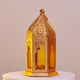 Gold-toned Golden Glow Ramadan Lantern with intricate cutouts and yellow glass, 6-inch decor piece for festive ambiance and luxury interiors.