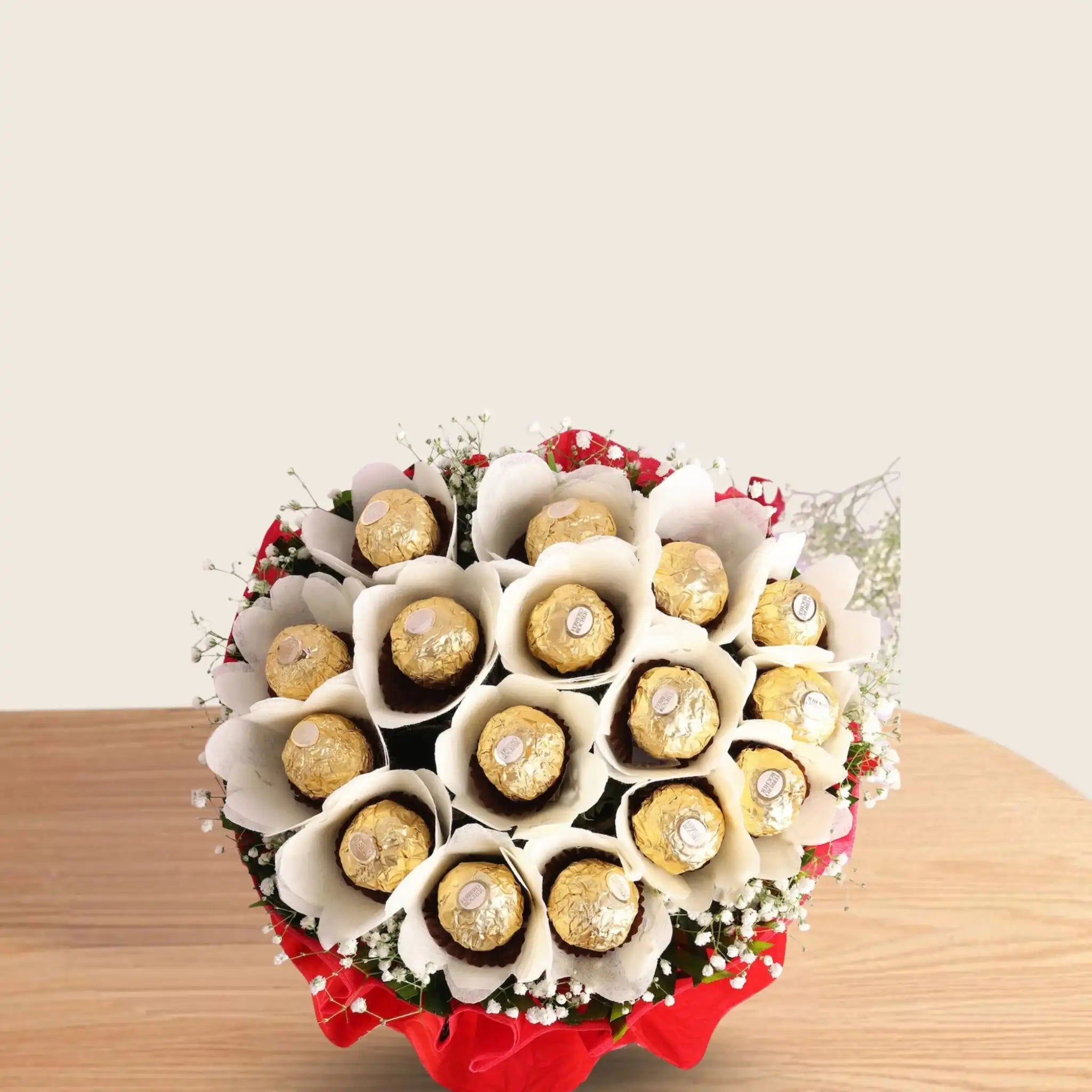 Ferrero Rocher Bunch - Chocolate Bouquet | 16 Piece Pack arranged in red and white paper with green fillers and white ribbon, perfect for gifting.