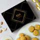 Desi Ghee Besan Laddoo - Authentic Sweets | 200gms & 400gms in elegant black gift box with golden accents, ideal for festive gifting.
