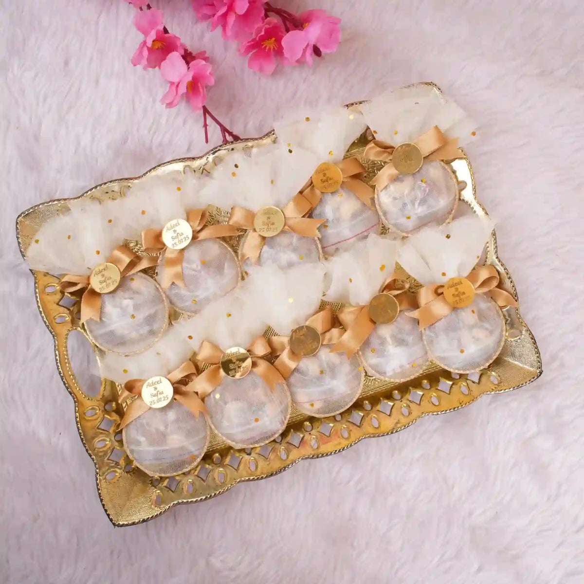 Tray of Golden Heart Nikah Favors featuring gold bows and custom tags, designed for Nikah ceremonies and wedding favor gifting in bulk.