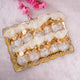 Tray of Golden Heart Nikah Favors featuring gold bows and custom tags, designed for Nikah ceremonies and wedding favor gifting in bulk.