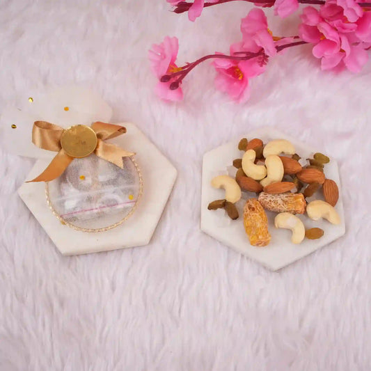 Golden Heart Nikah Favor pouch with assorted dry fruits displayed on marble coasters, perfect for religious wedding ceremonies and Nikah gift essentials.