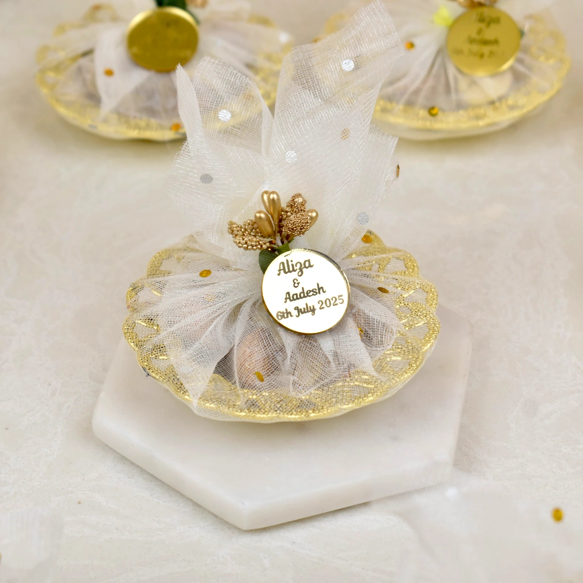 Mix Dry-Fruit Nikah Favor Gift Tray with personalized gold tag, wrapped in white net fabric and decorated with golden accents. Main image