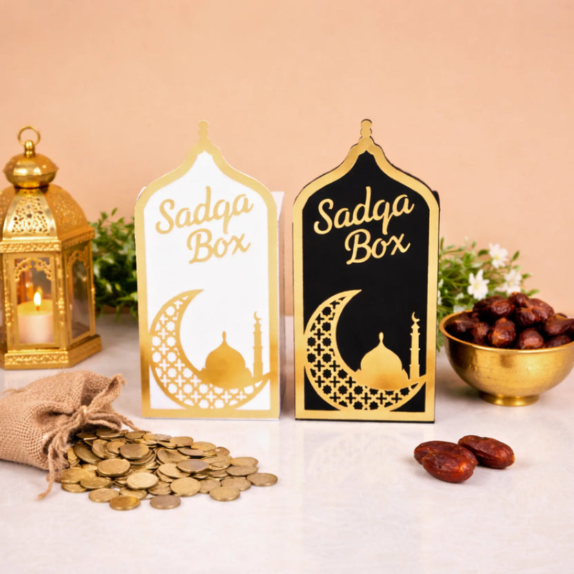 Elegant white and black Sadaqah Box set with gold Islamic motifs, ideal for Ramadan gifts and home decor in the Religious Items category. Main image