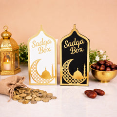 Elegant white and black Sadaqah Box set with gold Islamic motifs, ideal for Ramadan gifts and home decor in the Religious Items category.