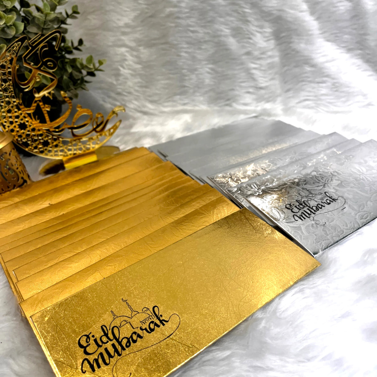 EID Mubarak Envelopes - Pack of 10 in gold and silver with Islamic patterns, ideal for gifting Eidi during Eid celebrations.