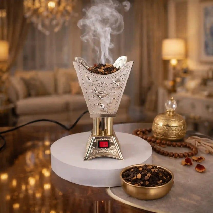 Empress Bakhoor Burner - Electric bakhoor burner with ornate silver detailing, releasing aromatic smoke in a luxurious living room setting. Main image