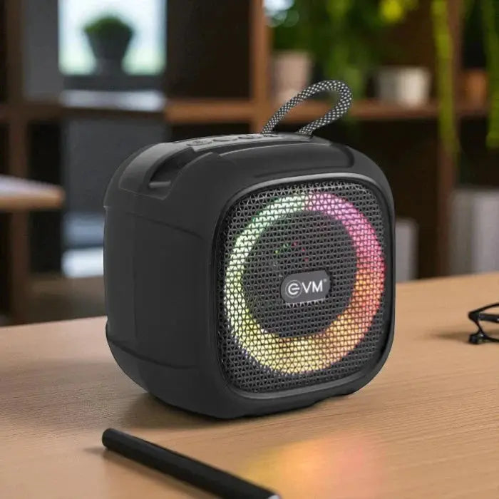 EnGroove Bluetooth Speaker with LED ring lights on a desk, showcasing its portable design and long battery life for on-the-go music lovers.