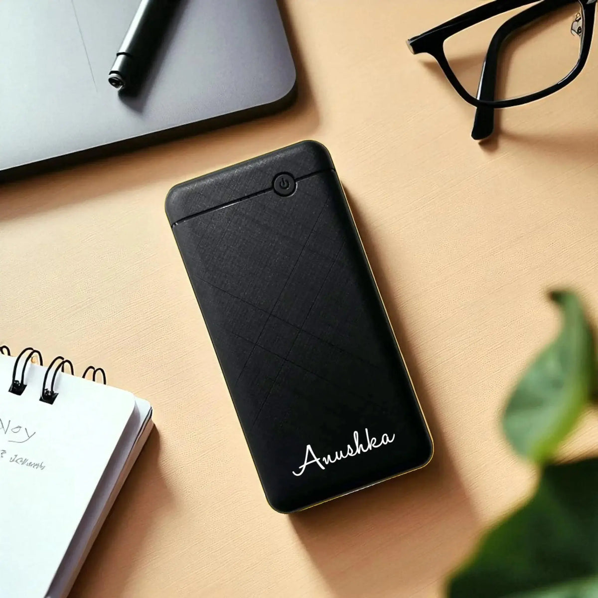 Black EnWing 10K mAh Powerbank - Portable 10000 mAh with name 'Anushka', stylish and efficient power bank for mobile charging.