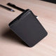 Angled view of black EnZest 10K mAh Powerbank showing its compact and ergonomic build for easy portability.