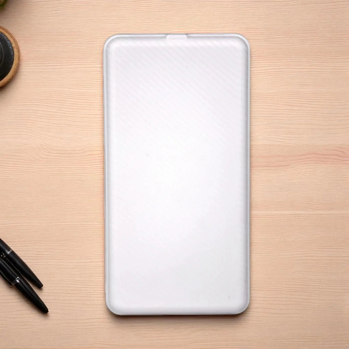 Top view of EnZest Powerbank 10000mAh in white, showcasing its slim and minimalist design for portable power solutions.