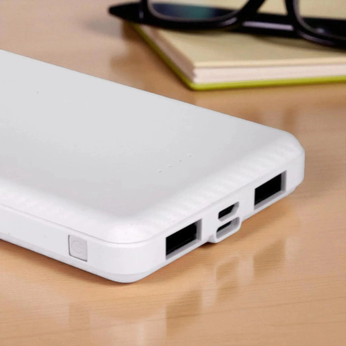 Close-up of EnZest 10K mAh Powerbank dual USB ports and USB input, perfect for charging multiple devices simultaneously.