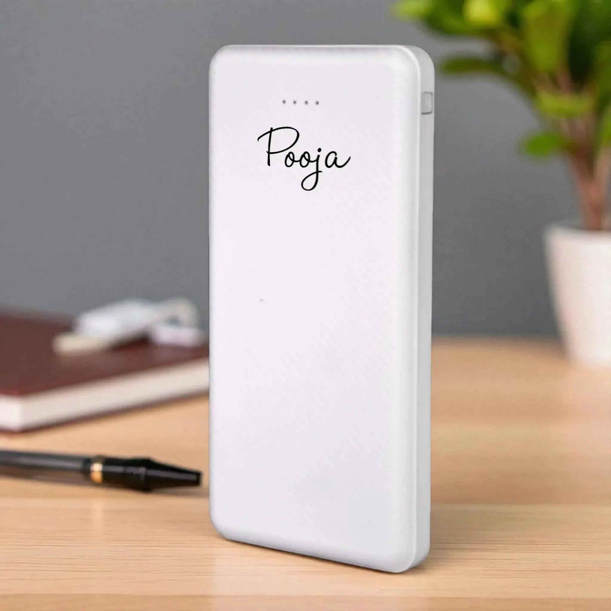 White EnZest 10K mAh Powerbank with custom name 'Pooja', compact design ideal for travel and daily charging needs. Main image