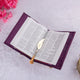 Open Quran with Urdu translation and gold feather bookmark. Included in the Purple Quran Hamper Set for multilingual readers.