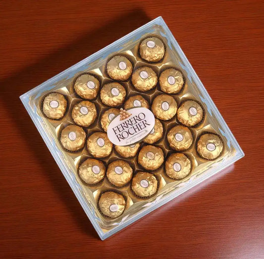 "Premium chocolate gift hamper with Ferrero Rocher, Cadbury Silk, KitKat chocolates, and elegant golden ribbon packaging – ideal for romantic and festive gifts."
